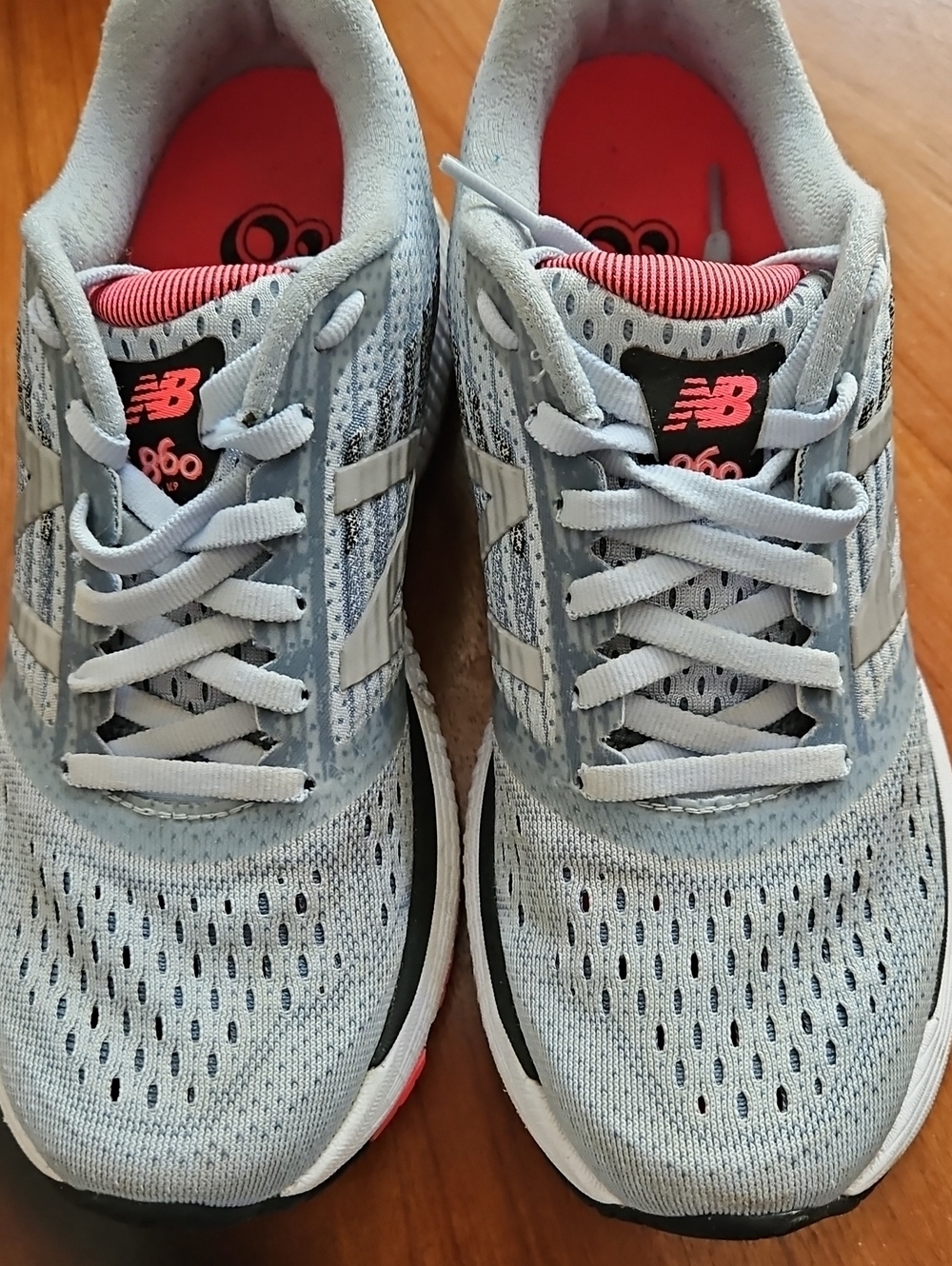 New Balance Women's Light Blue Athletic Sneakers with Pink Accents